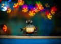 toy robot with colorful bokeh lights