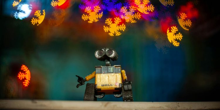 toy robot with colorful bokeh lights